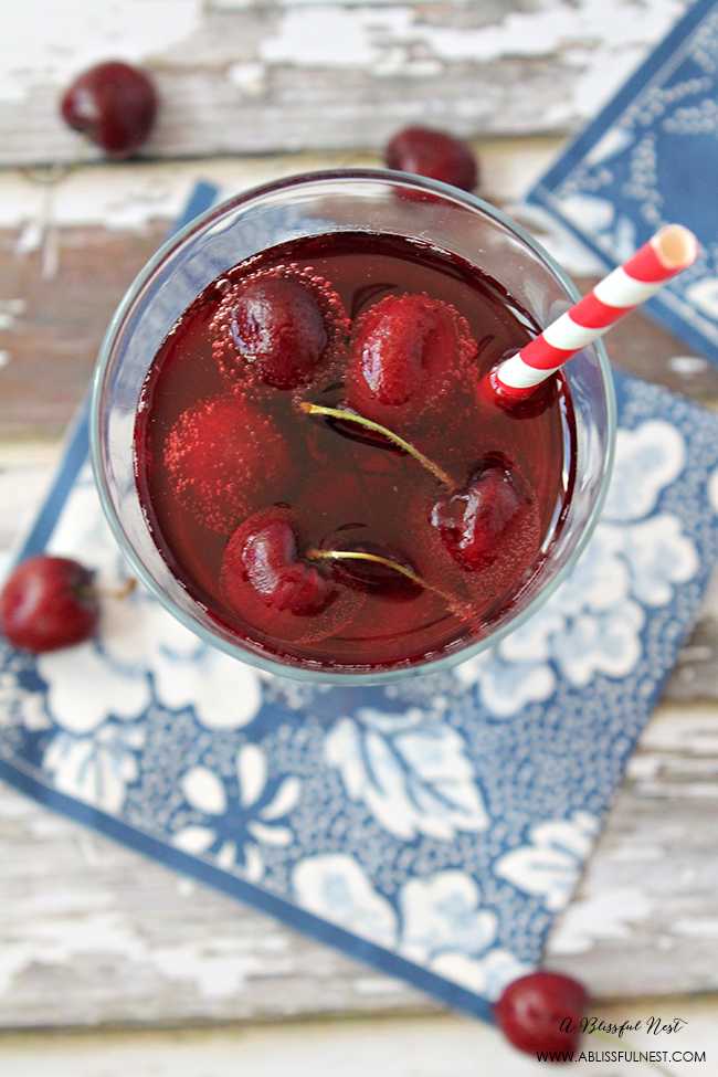 This delicious and refreshing cocktail recipe packs a punch! Full cherry sangria cocktail recipe details at ablisfulnest.com