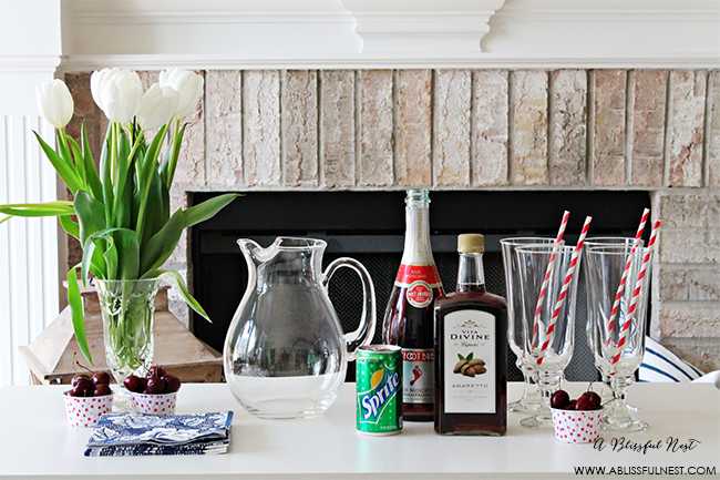 This delicious and refreshing cocktail recipe packs a punch! Full cherry sangria cocktail recipe details at ablisfulnest.com