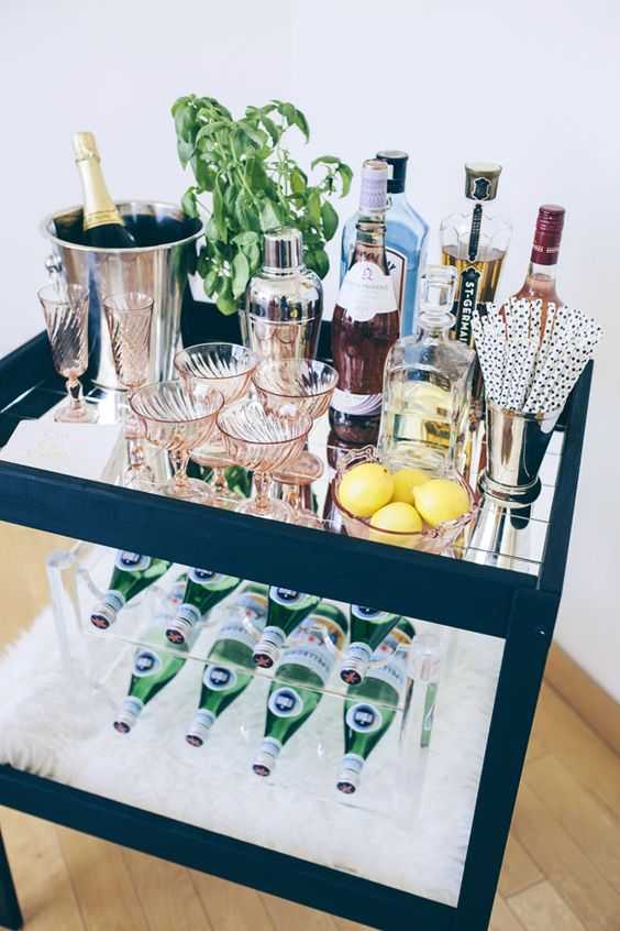Use our recipe for success to stock the PERFECT bar cart! A complete list of all the essential items you need for the most stylish bar cart for your next party by A Blissful Nest.