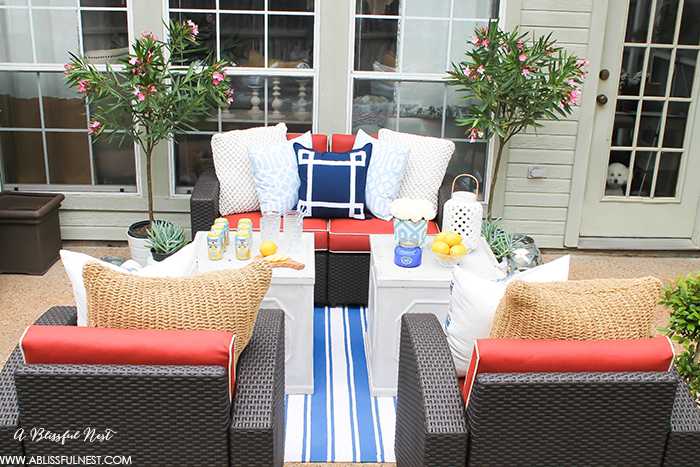 If you've got a small patio then you are not alone. BUT you do not have to sacrifice that designer look because of space issues. We are showing you simple tips to get that designer look with these small patio solutions. Via A Blissful Nest https://ablisfulnest.com #patiodecor #backyarddecor #homedecor #interiordesign #designtips