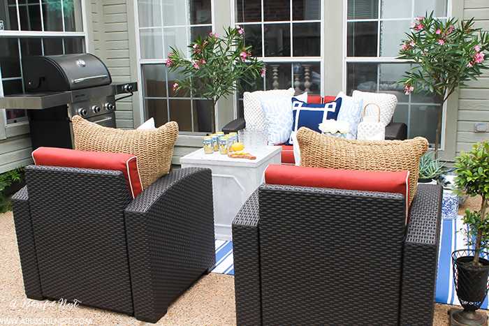 If you've got a small patio then you are not alone. BUT you do not have to sacrifice that designer look because of space issues. We are showing you simple tips to get that designer look with these small patio solutions. Via A Blissful Nest https://ablisfulnest.com #patiodecor #backyarddecor #homedecor #interiordesign #designtips