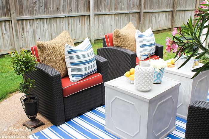 If you've got a small patio then you are not alone. BUT you do not have to sacrifice that designer look because of space issues. We are showing you simple tips to get that designer look with these small patio solutions. Via A Blissful Nest https://ablisfulnest.com #patiodecor #backyarddecor #homedecor #interiordesign #designtips