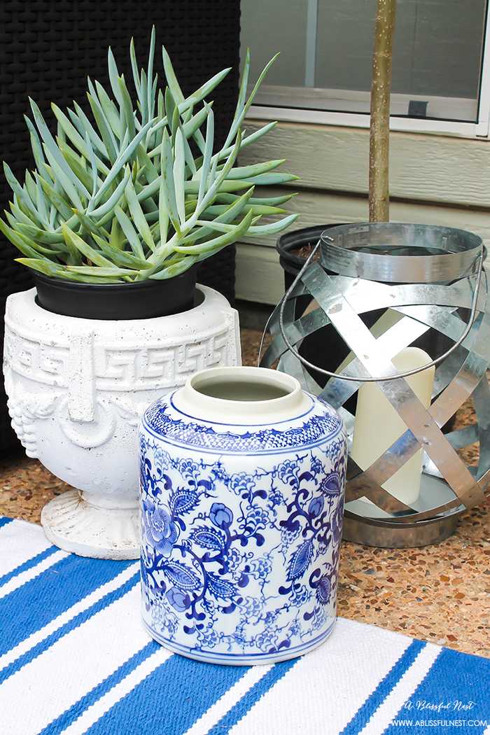 If you've got a small patio then you are not alone. BUT you do not have to sacrifice that designer look because of space issues. We are showing you simple tips to get that designer look with these small patio solutions. Via A Blissful Nest https://ablisfulnest.com #patiodecor #backyarddecor #homedecor #interiordesign #designtips