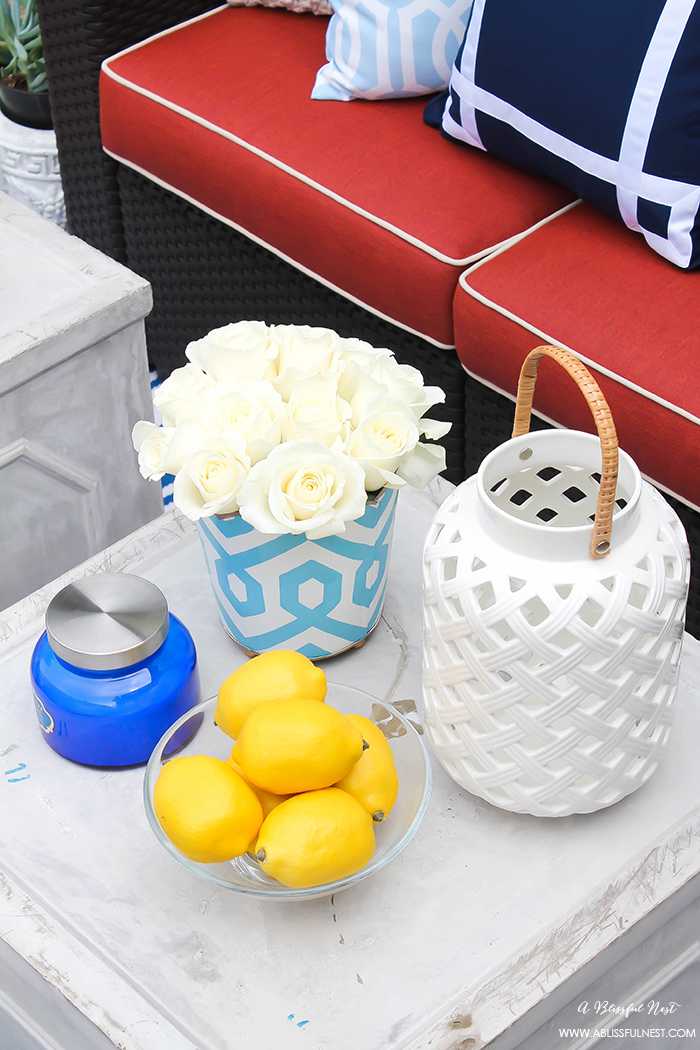 If you've got a small patio then you are not alone. BUT you do not have to sacrifice that designer look because of space issues. We are showing you simple tips to get that designer look with these small patio solutions. Via A Blissful Nest https://ablisfulnest.com #patiodecor #backyarddecor #homedecor #interiordesign #designtips