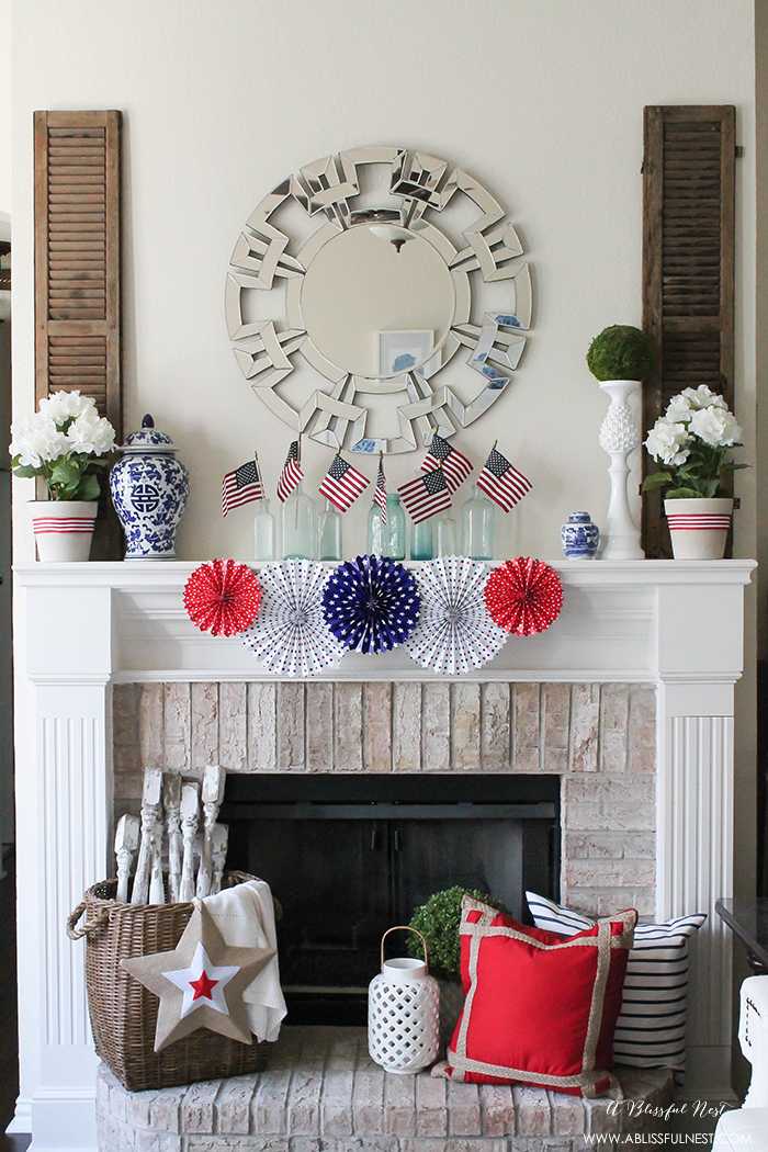 I adore the vintage Americana 4th of July mantle decor! With pops of aqua this is the perfect 4th of July decor by A Blissful Nest. https://ablisfulnest.com #4thofjuly #redwhiteandblue #4thofjulydecor