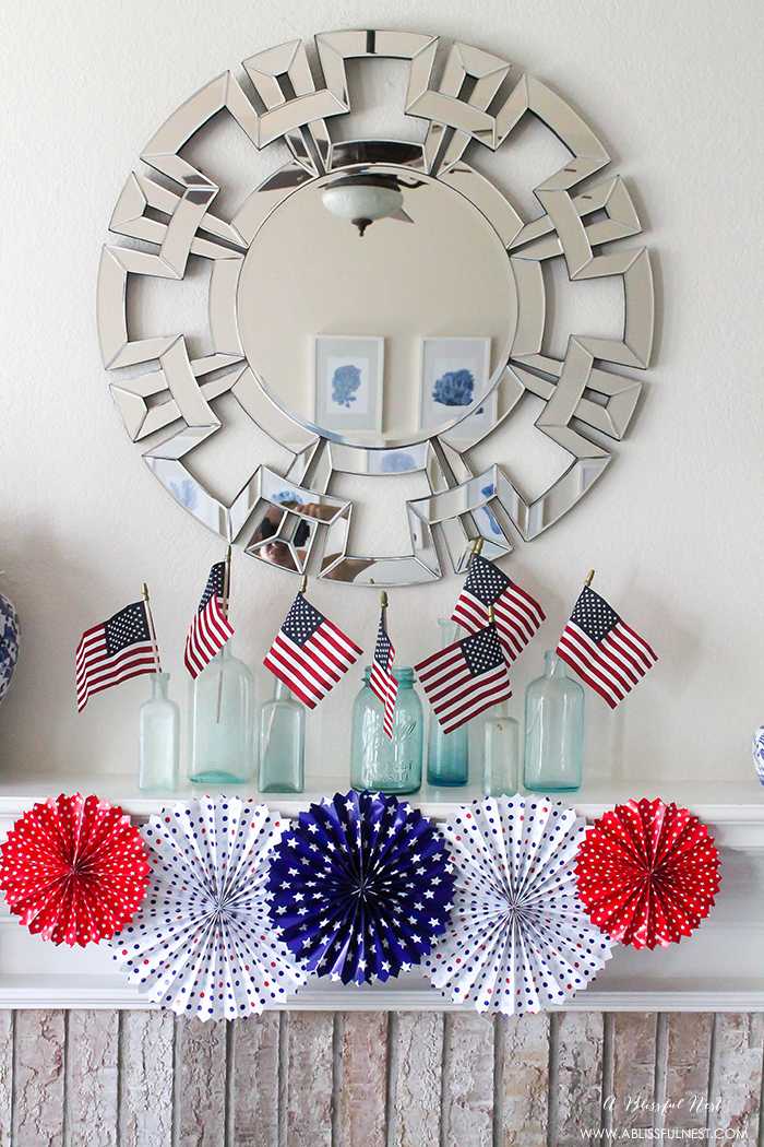 I adore the vintage Americana 4th of July mantle decor! With pops of aqua this is the perfect 4th of July decor by A Blissful Nest. https://ablisfulnest.com #4thofjuly #redwhiteandblue #4thofjulydecor