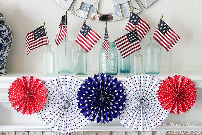 I adore the vintage Americana 4th of July mantle decor! With pops of aqua this is the perfect 4th of July decor by A Blissful Nest. https://ablisfulnest.com #4thofjuly #redwhiteandblue #4thofjulydecor