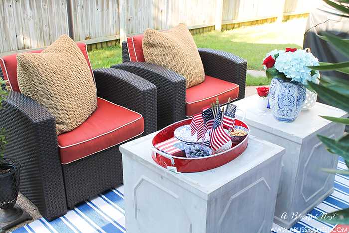 These are such great ideas to celebrate 4th of July with! I love all the Americana red, white and blue pops of color on this patio. Check out more on A Blissful Nest. https://ablisfulnest.com #4thofjuly #4thofjulydecor #redwhiteandblue