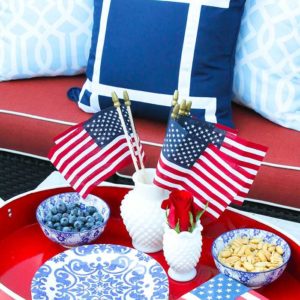 These are such great ideas to celebrate 4th of July with! I love all the Americana red, white and blue pops of color on this patio. Check out more on A Blissful Nest. https://ablisfulnest.com #4thofjuly #4thofjulydecor #redwhiteandblue