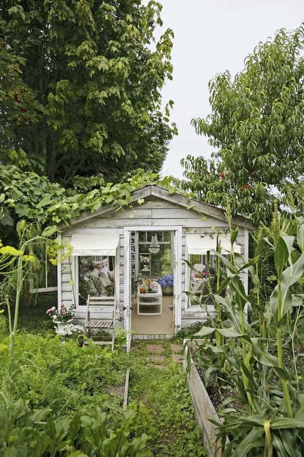 Shabby Chic She Shed via House Beautiful, The Best She Sheds via A Blissful Nest