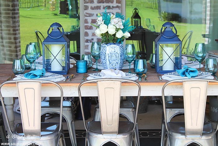 Fresh coastal table décor ideas for the perfect summer night. Grab these tips on setting the perfect coastal tablescape by A Blissful Nest. https://ablisfulnest.com/ #coastal #tabledecor #tabledecorideas #coastalinteriors #coastalroom #ocean #blueandwhite