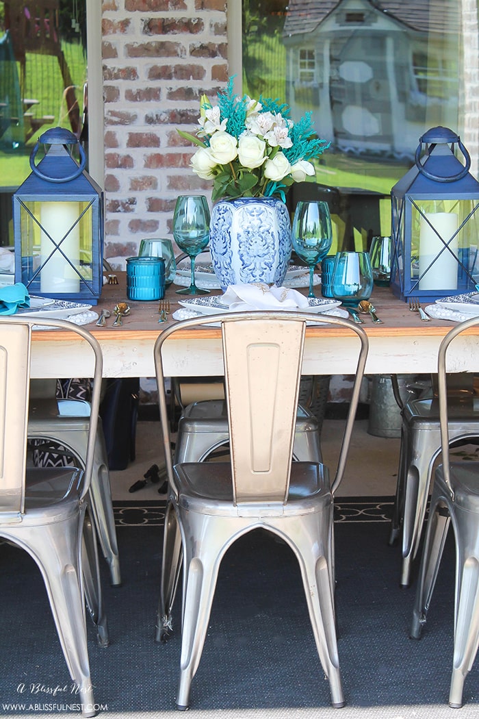 Fresh coastal table décor ideas for the perfect summer night. Grab these tips on setting the perfect coastal tablescape by A Blissful Nest. https://ablisfulnest.com/ #coastal #tabledecor #tabledecorideas #coastalinteriors #coastalroom #ocean #blueandwhite