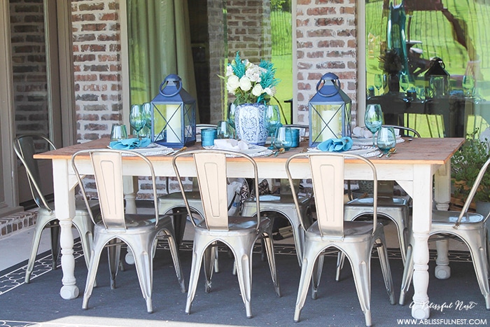 Fresh coastal table décor ideas for the perfect summer night. Grab these tips on setting the perfect coastal tablescape by A Blissful Nest. https://ablisfulnest.com/ #coastal #tabledecor #tabledecorideas #coastalinteriors #coastalroom #ocean #blueandwhite