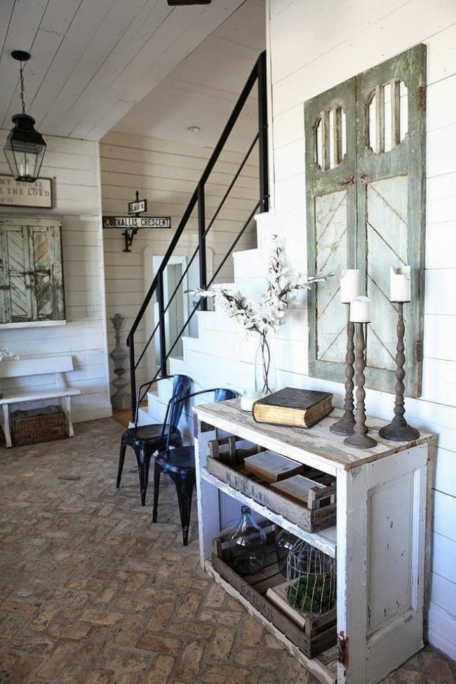 Love this entryway! It's the perfect farmhouse style with repurposed wood accents everywhere. Cote de Texas, 20 Best Fixer Upper Rooms 