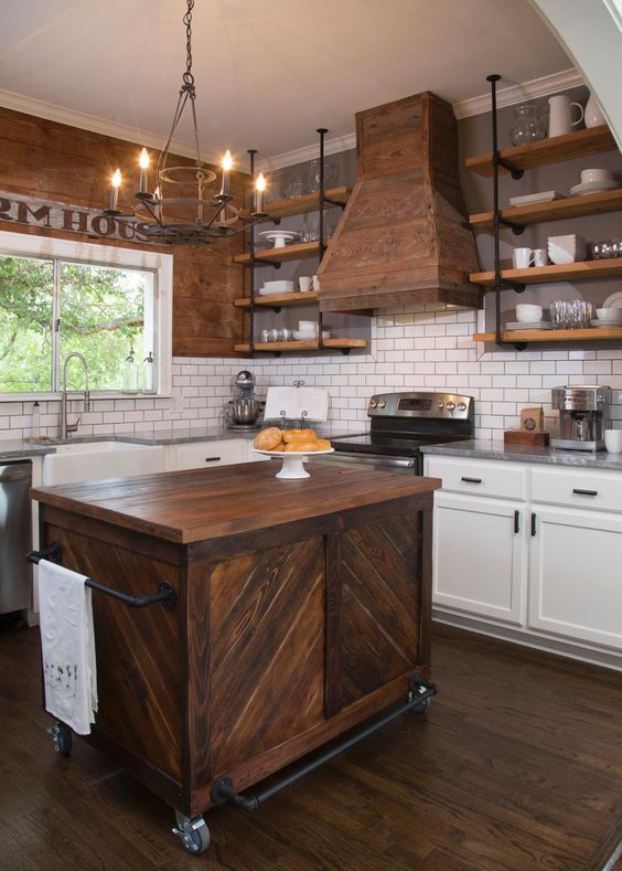 This farmhouse kitchen looks perfectly authentic, with rich wood cabinets and a gorgeous, functional kitchen island. HGTV Craftsman Remodel, 20 Best Fixer Upper Rooms
