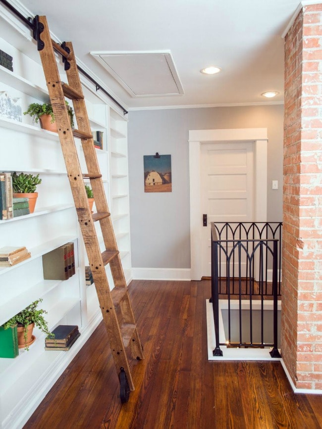 This upstairs landing does not go to waste in this home. Love this library bookcase concept, and the ladder adds a little bit of farmhouse flair without overtaking the scene. HGTV Texas Sized House, 20 Best Fixer Upper Rooms 