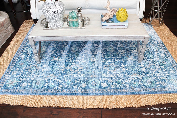 It’s time for a change! Show some designer flare and learn how to layer rugs like a pro. The designers all do it for a reason. It makes BIG impact. Make your room pop with these 5 simple tips from A Blissful Nest. https://ablisfulnest.com/ #rugideas #designtips #homedecortips #livingroom #livingroomideas 