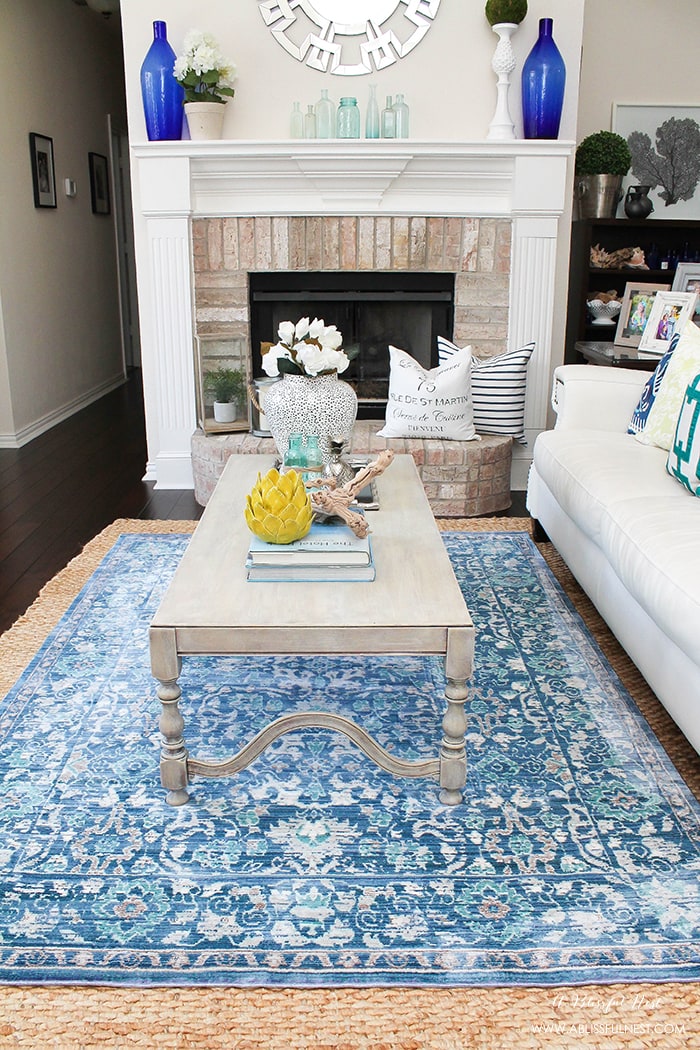 It’s time for a change! Show some designer flare and learn how to layer rugs like a pro. The designers all do it for a reason. It makes BIG impact. Make your room pop with these 5 simple tips from A Blissful Nest. https://ablisfulnest.com/ #rugideas #designtips #homedecortips #livingroom #livingroomideas 