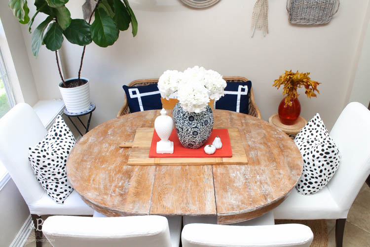 Check out these gorgeous coastal accents in this fall home tour with A Blissful Nest! Love the pops of orange in this home with its neutral pallet. See more at https://ablisfulnest.com/ #fallfrontporch #falldecorating #falldecor #fallhometour
