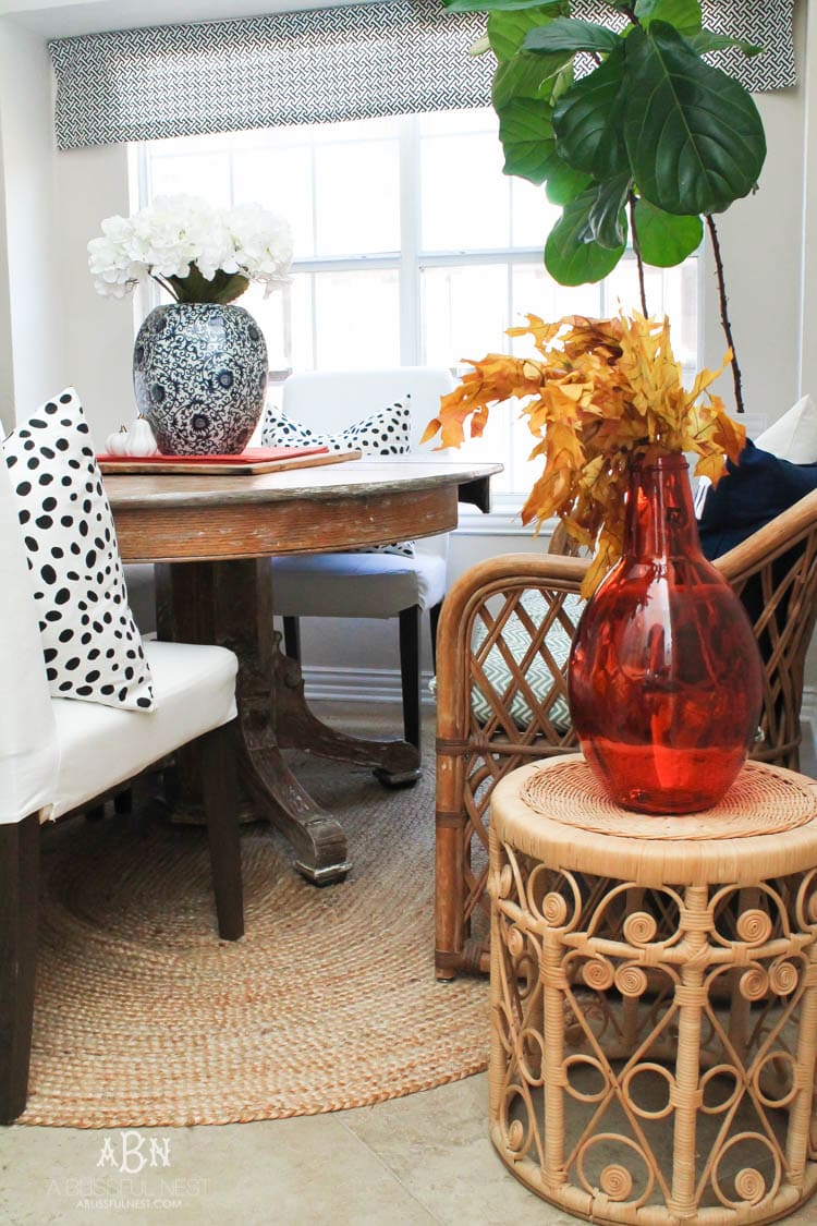Check out these gorgeous coastal accents in this fall home tour with A Blissful Nest! Love the pops of orange in this home with its neutral pallet. See more at https://ablisfulnest.com/ #fallfrontporch #falldecorating #falldecor #fallhometour