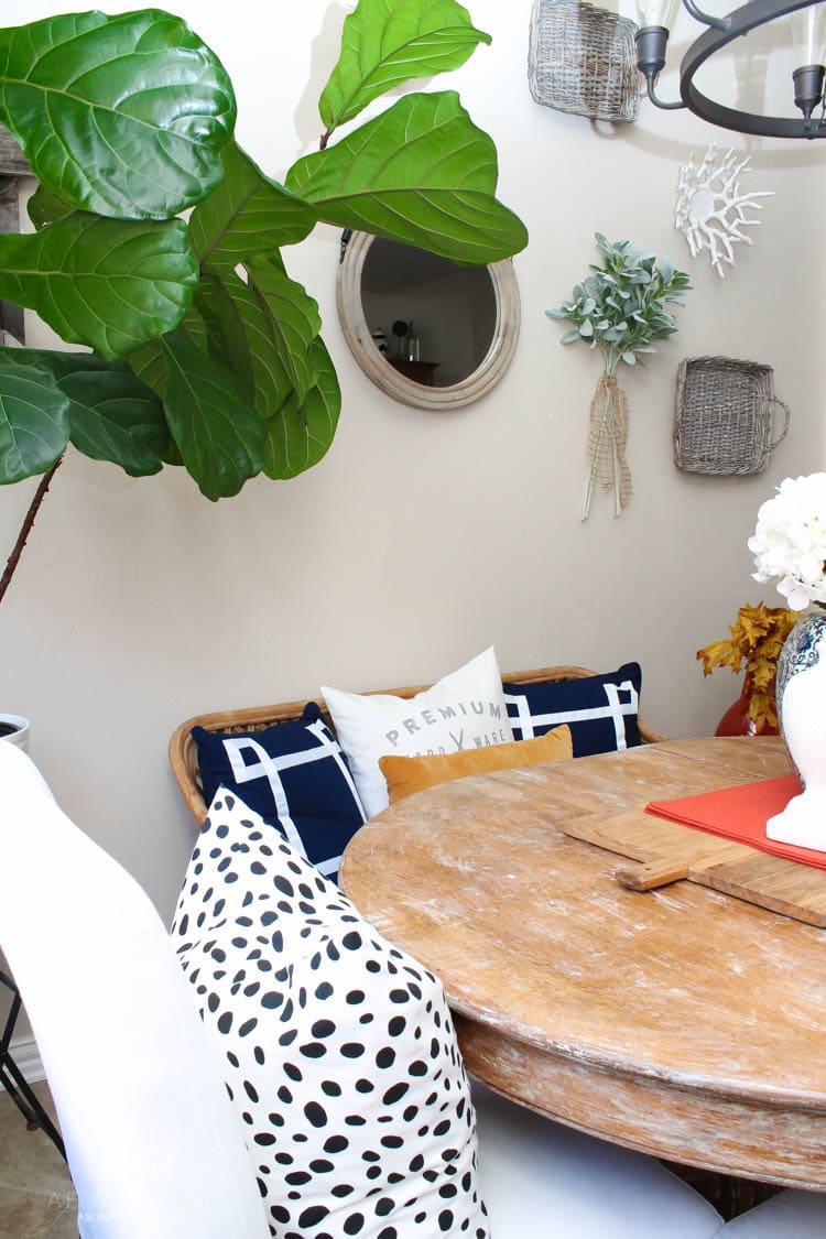 Check out these gorgeous coastal accents in this fall home tour with A Blissful Nest! Love the pops of orange in this home with its neutral pallet. See more at https://ablisfulnest.com/ #fallfrontporch #falldecorating #falldecor #fallhometour