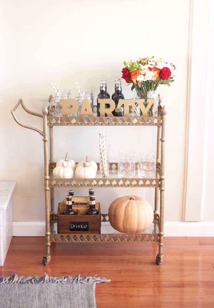 This festive fall bar cart is perfect for any entertaining occasion or even a quiet evening at home. Be prepared for anyone who may stop by, too! Seen on https://ablisfulnest.com/ #fall #entertaining #barcart