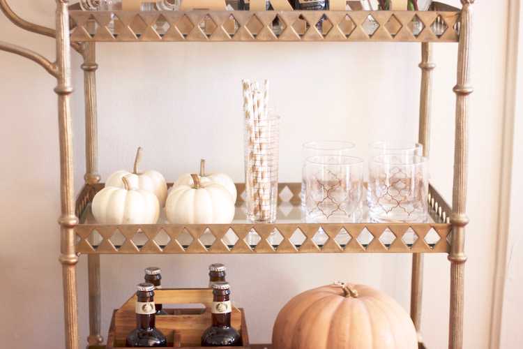 This festive fall bar cart is perfect for any entertaining occasion or even a quiet evening at home. Be prepared for anyone who may stop by, too! Seen on https://ablisfulnest.com/ #fall #entertaining #barcart