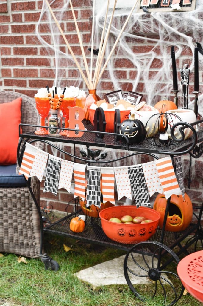 This Halloween Bar Cart isn't only for adults, this adorable cart is kid-friendly and oh so fun! Such a great way to celebrate this fun holiday! https://ablisfulnest.com/ #Halloween #Entertaining #HalloweenParty