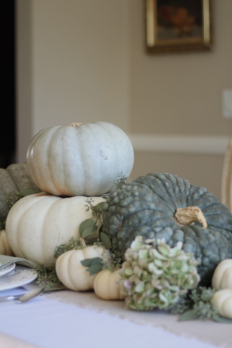 This neutral Fall tablescape is full of natural elements, brown toile dishes and loads of pumpkins and dried florals. Visit https://ablisfulnest.com/ for all of the details! #NeutralDecor #Fall #FallTablescape