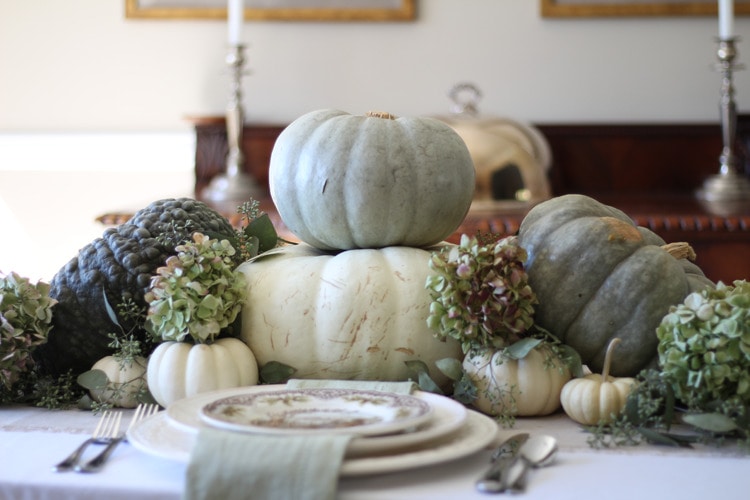 This neutral Fall tablescape is full of natural elements, brown toile dishes and loads of pumpkins and dried florals. Visit https://ablisfulnest.com/ for all of the details! #NeutralDecor #Fall #FallTablescape