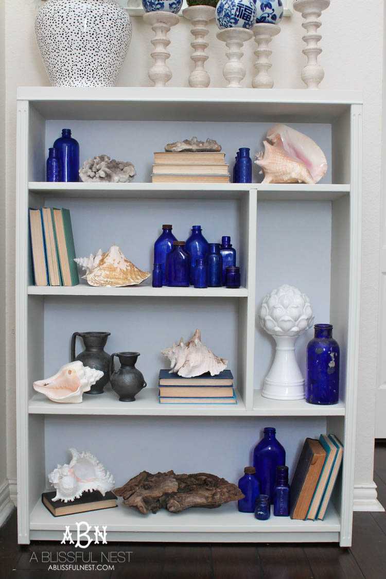 Got an old bookcase that needs to be updated? Checkout how this bookcase went from boring to fabulous with just a few easy steps! See more on https://ablisfulnest.com/ #bookcasemakeover #diybookcase #chalkfurniturepaint