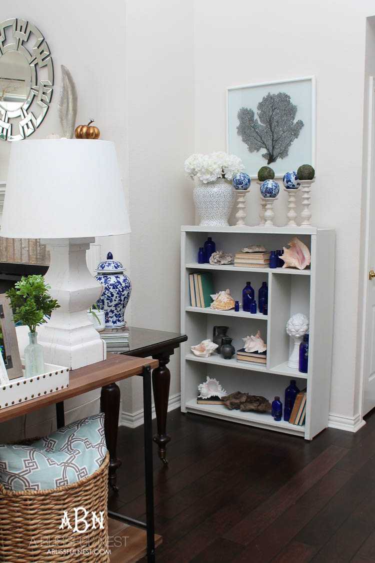 Got an old bookcase that needs to be updated? Checkout how this bookcase went from boring to fabulous with just a few easy steps! See more on https://ablisfulnest.com/ #bookcasemakeover #diybookcase #chalkfurniturepaint