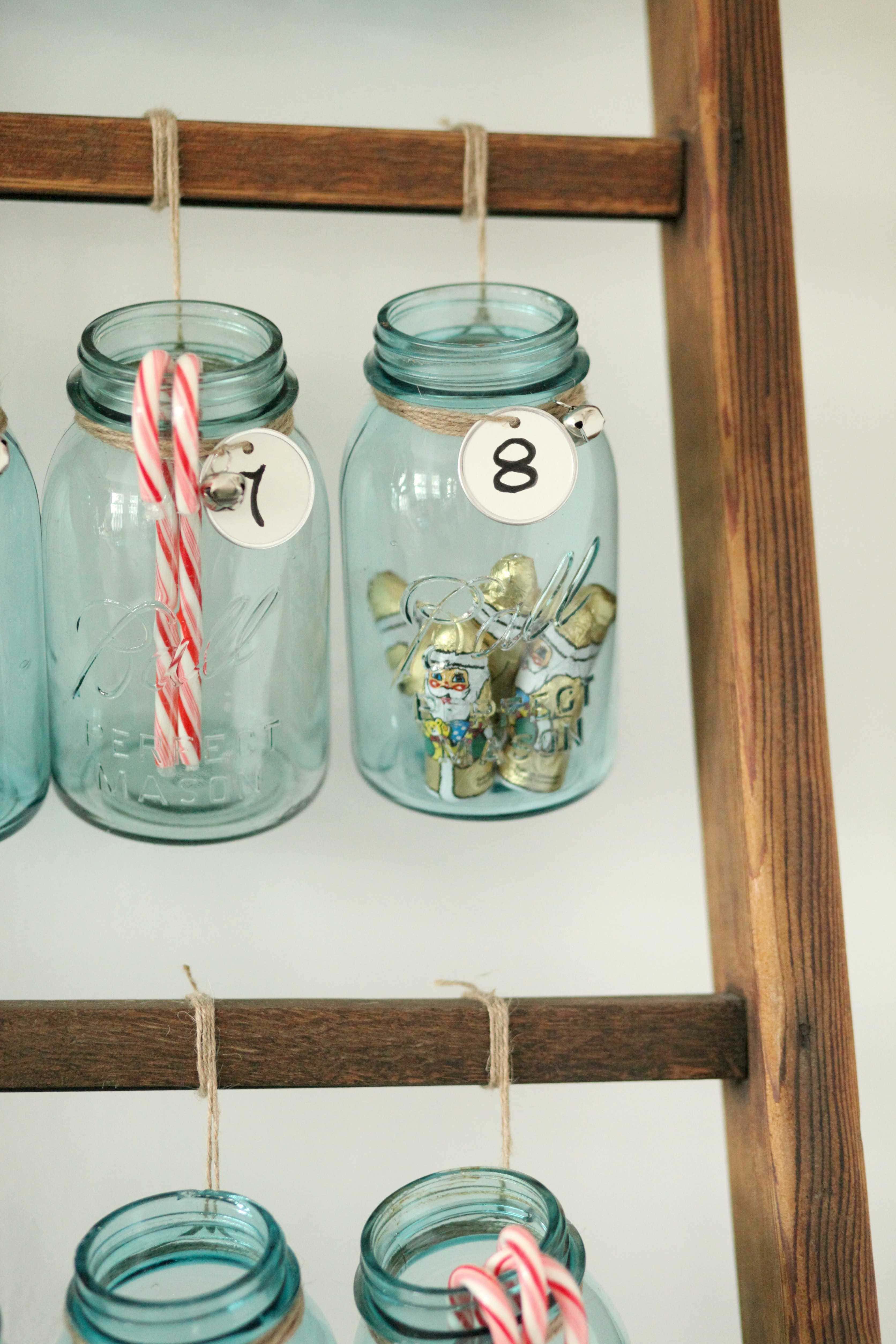 Beautiful Christmas decor using a Vintage Ladder for a Mason Jar Advent Calendar. So festive and fun! See more on https://ablisfulnest.com/ #Christmas #Advent #ChristmasDecor