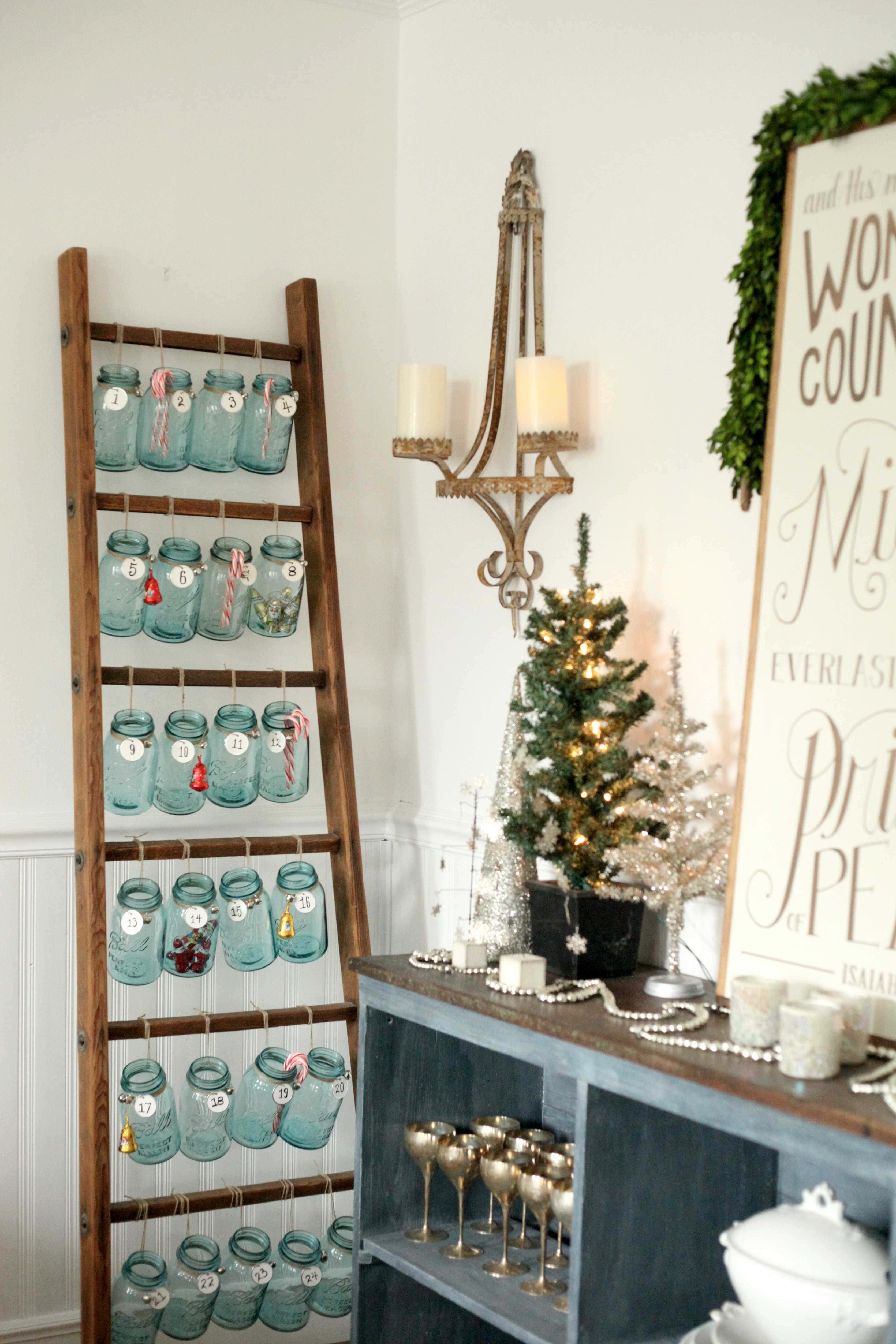 Beautiful Christmas decor using a Vintage Ladder for a Mason Jar Advent Calendar. So festive and fun! See more on https://ablisfulnest.com/ #Christmas #Advent #ChristmasDecor