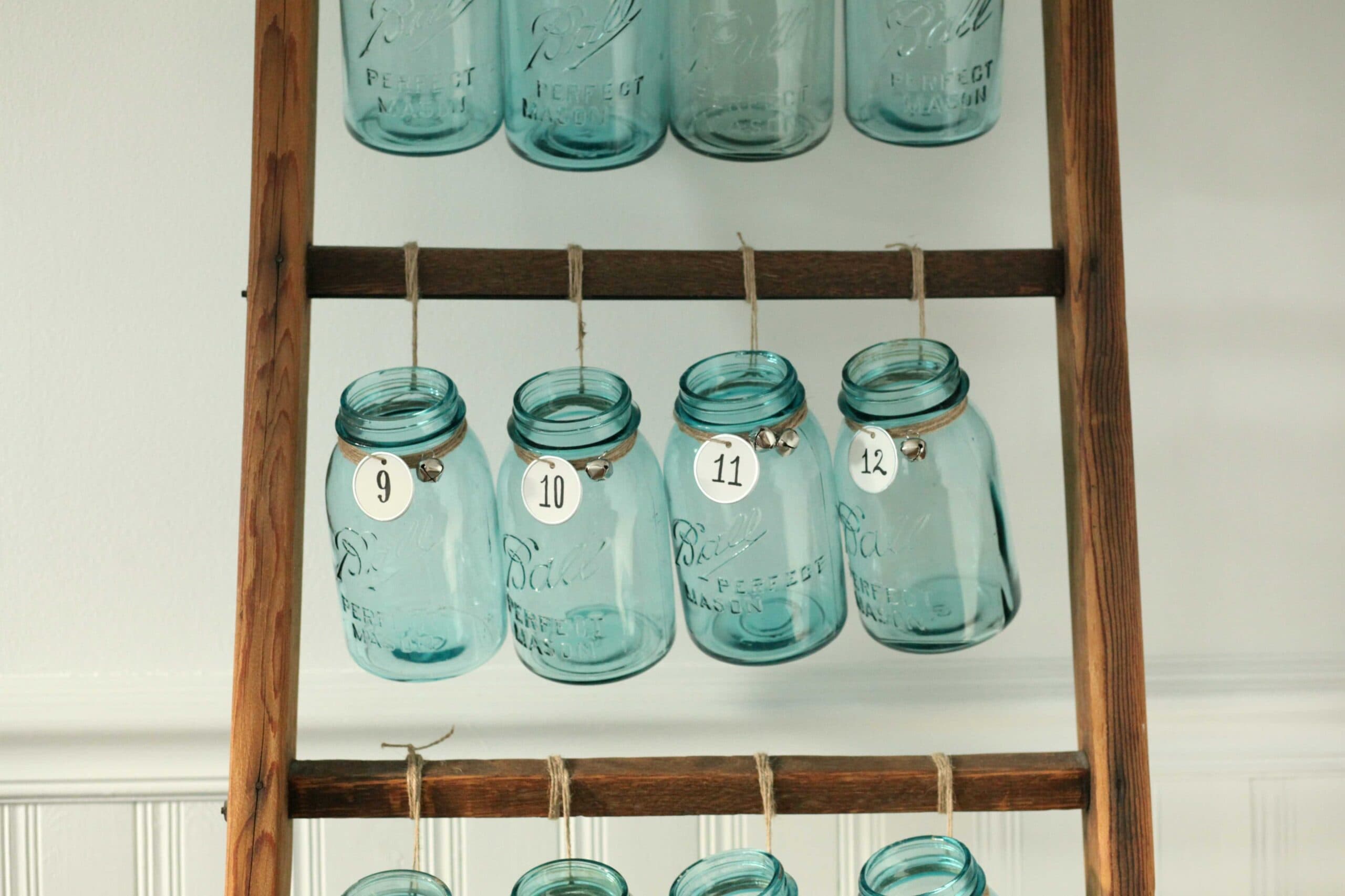 Beautiful Christmas decor using a Vintage Ladder for a Mason Jar Advent Calendar. So festive and fun! See more on https://ablisfulnest.com/ #Christmas #Advent #ChristmasDecor