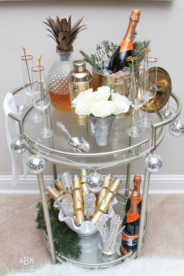 These are such great ideas to transition your Christmas décor into celebrating New Years Eve! Love all the gold and sparkly accents! See more on https://ablisfulnest.com/ #newyearseve #newyearsbarcart #ad #Pier1Love