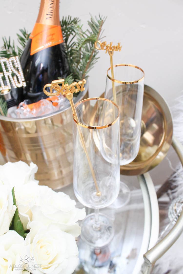 These are such great ideas to transition your Christmas décor into celebrating New Years Eve! Love all the gold and sparkly accents! See more on https://ablisfulnest.com/ #newyearseve #newyearsbarcart #ad #Pier1Love