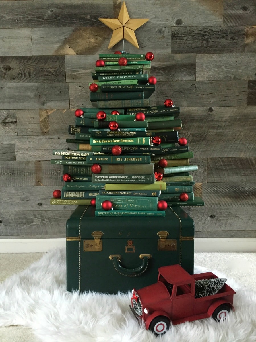 Collect Books for a DIY vintage inspired book Christmas tree. See how to make it at https://ablisfulnest.com/ #Christmas #ChristmasDecor #DecoratingWIthBooks
