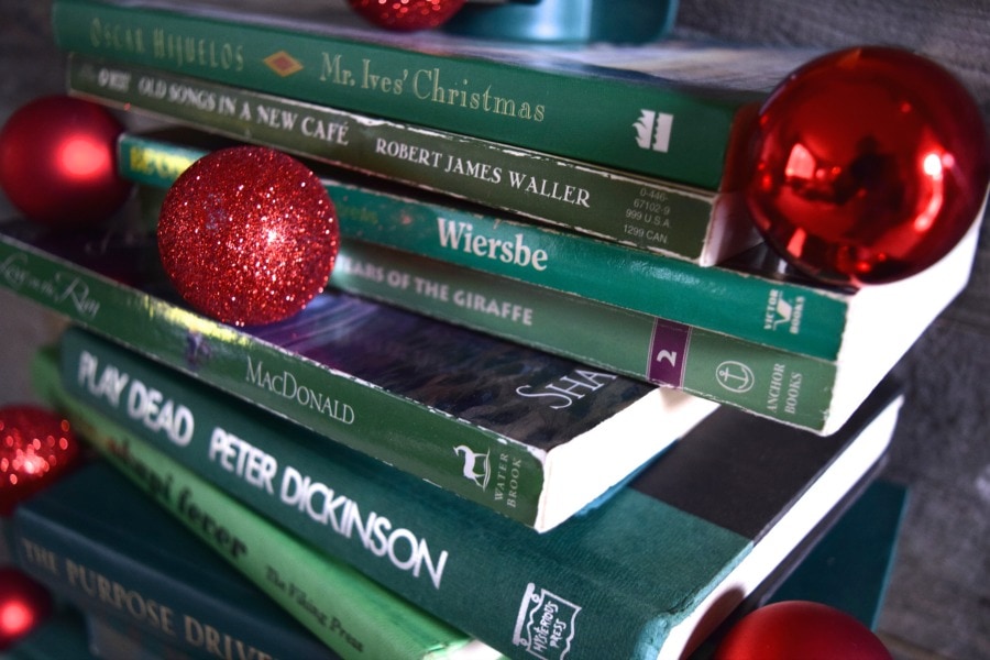 Collect Books for a DIY vintage inspired book Christmas tree. See how to make it at https://ablisfulnest.com/ #Christmas #ChristmasDecor #DecoratingWIthBooks