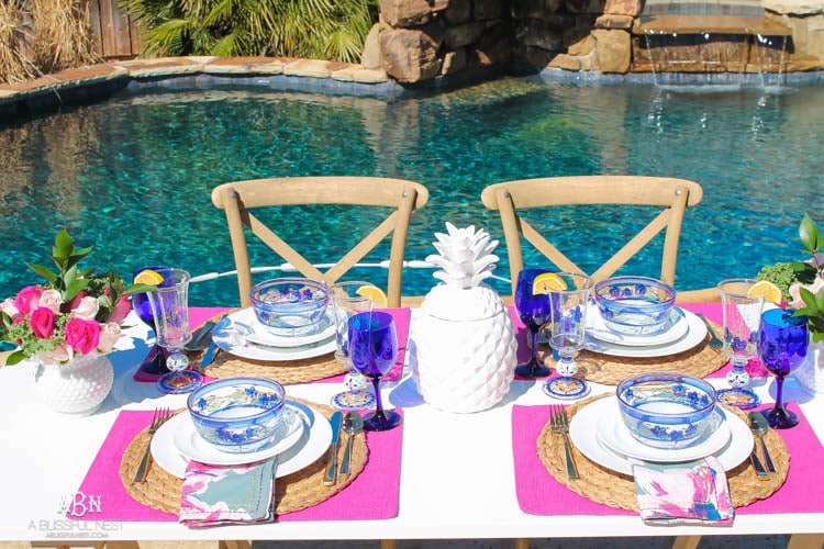 A bright and fresh spring table setting idea perfect for Easter, Mother's Day or a pool party! See more on https://ablisfulnest.com/ #tablesetting #tablescape #springtabledecor