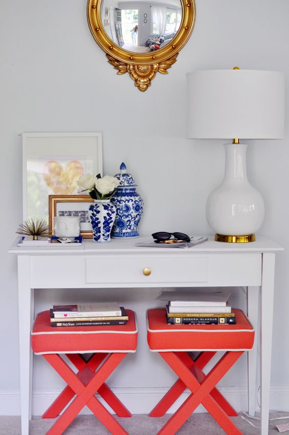 Easy ways to style a console table by adding height, seating, and accessories. for more ideas go to www.ablisfulnest.com #interiors #tips