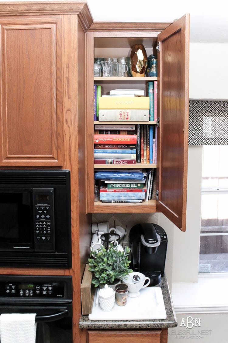 This is such a great idea! Transform a dead cabinet space with these coffee cabinet organization ideas! See more on https://ablisfulnest.com/ #coffee #coffeestation