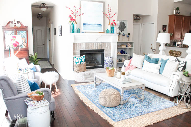 It's time to redecorate for spring! Love this fresh and inviting spring living room! See more on https://ablisfulnest.com/ #springdecorating #livingroom