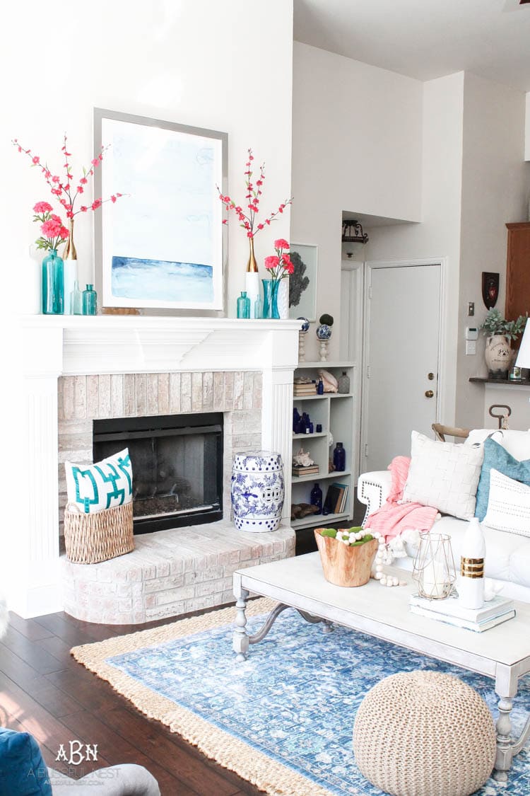 It's time to redecorate for spring! Love this fresh and inviting spring living room! See more on https://ablisfulnest.com/ #springdecorating #livingroom