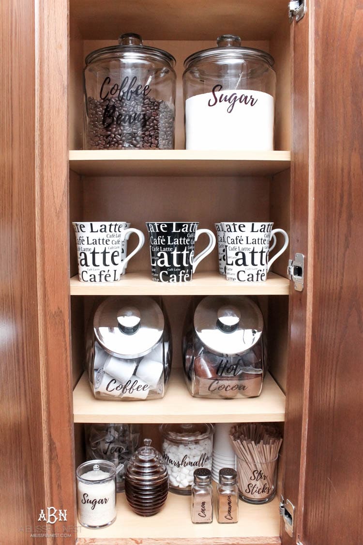 This is such a great idea! Transform a dead cabinet space with these coffee cabinet organization ideas! See more on https://ablisfulnest.com/ #coffee #coffeestation