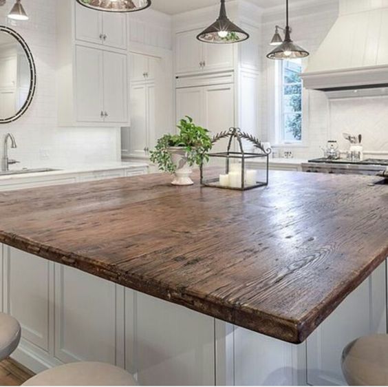 There are many ways and simple ideas to add warmth to your all white kitchen. Visit https://ablisfulnest.com/ to find out how! #interiors #kitchens #designertips