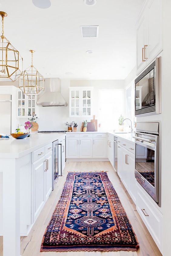 There are many ways and simple ideas to add warmth to your all white kitchen. Visit https://ablisfulnest.com/ to find out how! #interiors #kitchens #designertips