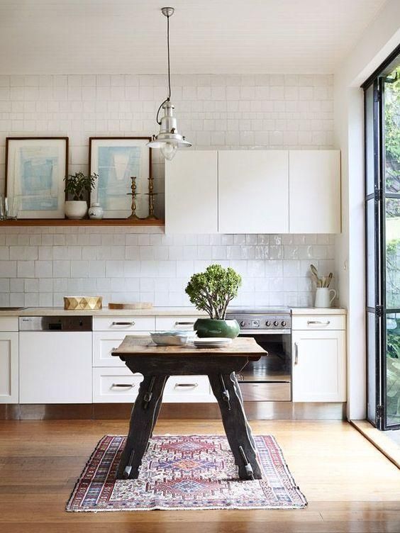There are many ways and simple ideas to add warmth to your all white kitchen. Visit https://ablisfulnest.com/ to find out how! #interiors #kitchens #designertips