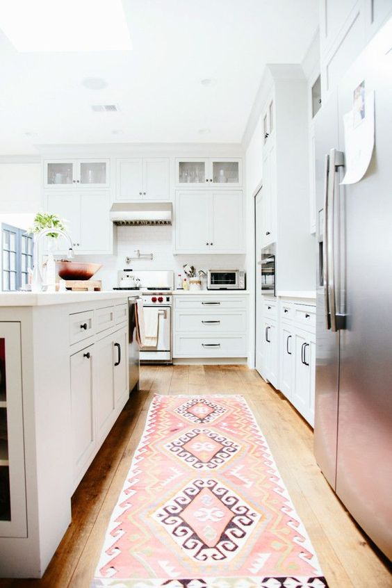 There are many ways and simple ideas to add warmth to your all white kitchen. Visit https://ablisfulnest.com/ to find out how! #interiors #kitchens #designertips