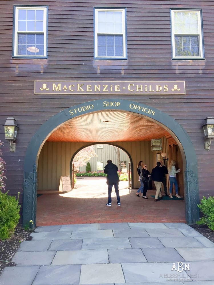 See behind the scenes with MacKenzie-Childs and how this iconic brand has taken over the country in home decor! See more on https://ablisfulnest.com/ #campcourtlycheck #mackenziechilds #ad